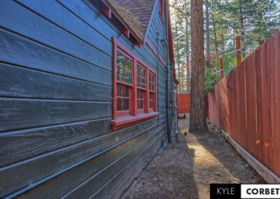 Affordable Getaway Big Bear Mountain Cabin Airbnb 8 person exterior side view with natural woodworking
