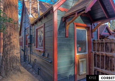 Affordable Getaway Big Bear Mountain Cabin Airbnb 8 person back view with natural woodworking